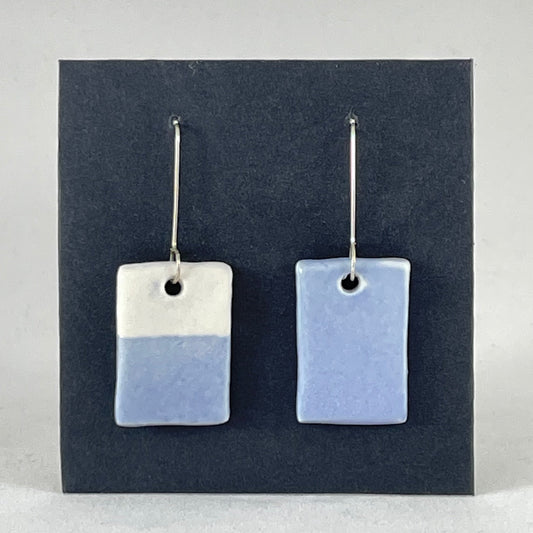 A pair of hand formed porcelain earrings in delicate blue and white