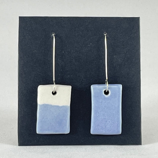 A pair of hand formed porcelain earrings in delicate blue and white