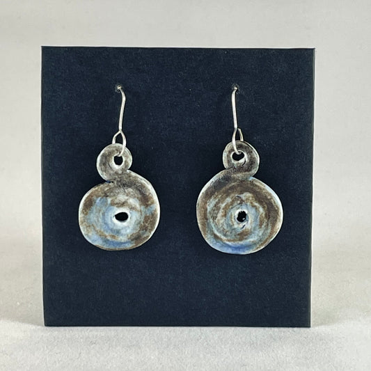 Pair of hand coiled pendant earrings. Blue brown and white textured pattern.
