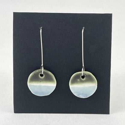 Pair of circular porcelain earrings with  bands of colour: dark green, white and pale blue. On long sterling silver earring hooks.