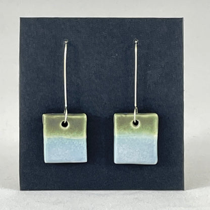 A pair of square shaped porcelain earrings in blue and green. On sterling silver earrings hooks.